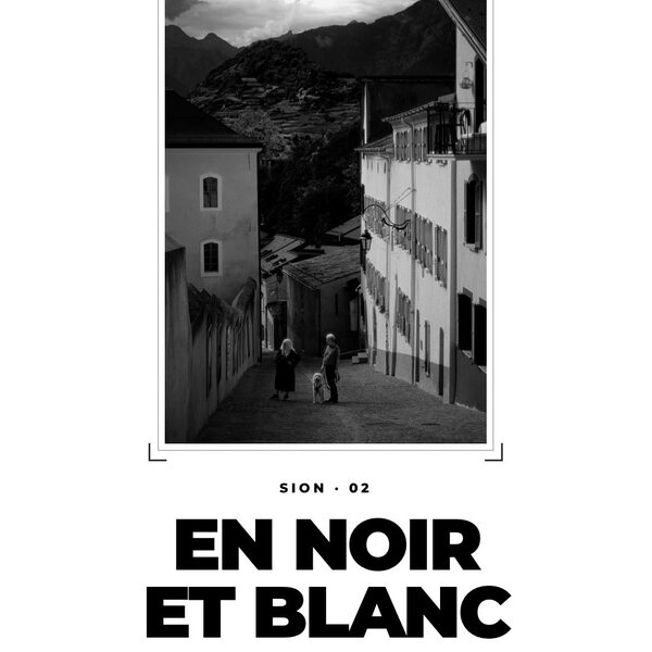 Sion en noir et blanc.
Des volets, des balcons, la tour de Tourbillon dans les nuages et q…